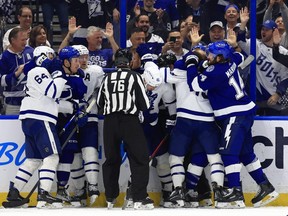 Players on the Toronto Maple Leafs and Tampa Bay Lightning engage in altercations during a game at Amalie Arena on April 21, 2022 in Tampa.