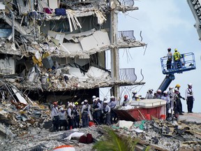 Workers search the rubble at the Champlain Towers South Condo, Monday, June 28, 2021, in Surfside, Fla.