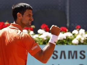 Serbia's Novak Djokovic celebrates winning his quarter final match against Poland's Hubert Hurkacz at the Madrid Open at Caja Magica May 6, 2022.