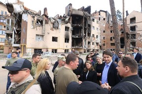 In this handout picture released on May 8, 2022 on the Telegram channel of Irpin Mayor Oleksandr Markushyn (centre), Canada’s Prime Minister Justin Trudeau (second from right) visits the city of Irpin on May 8, 2022 amid the Russian invasion of Ukraine.