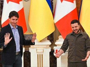 Ukrainian President Volodymyr Zelensky (right) and Prime Minister Justin Trudeau gesticulate during a joint press conference in Kiev on May 8, 2022, amid the Russian invasion of Ukraine.