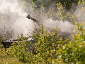 Smoke rises above a self-propelled howitzer 2S1 Gvozdika of pro-Russian troops, which fired a leaflet shell in the direction of Sievierodonetsk to disperse information materials from combat positions in the Luhansk region, Ukraine, May 24, 2022.