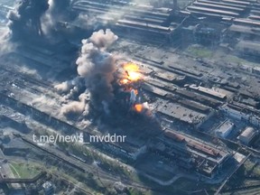 This undated video grab taken from a handout footage published on May 4, 2022 by the Interior Ministry of the self-proclaimed Donetsk People's Republic (DNR) on Telegram appear to show explosions at Mariupol's Azovstal steel plant.