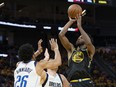 Golden State Warriors forward Andrew Wiggins (22) shoots the basketball against Dallas Mavericks guard Spencer Dinwiddie (26) during Game 1 of the Western Conference finals at Chase Center.