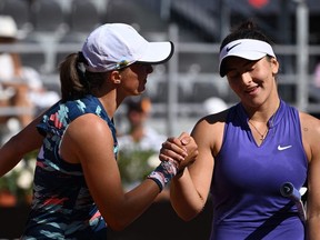 Poland's Iga Swiatek shakes hand with Canada's Bianca Andreescu after winning their quarter finals match at the WTA Rome Open tennis tournament on May 13, 2022 at Foro Italico in Rome. (Photo by Tiziana FABI / AFP)