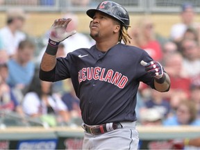 Cleveland Guardians third baseman Jose Ramirez reacts after hitting a home run against Minnesota Twins starting pitcher Joe Ryan (not pictured) during the fourth inning at Target Field.