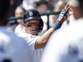 May 15, 2022; Detroit, Michigan, USA;  Detroit Tigers designated hitter Miguel Cabrera receives congratulations from teammates after he hits a home run in the second inning against the Baltimore Orioles at Comerica Park.