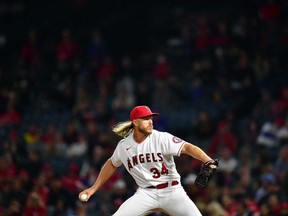 May 24, 2022; Anaheim, California, USA; Los Angeles Angels starting pitcher Noah Syndergaard (34) throws against the Texas Rangers during the eighth inning at Angel Stadium.