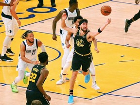 May 26, 2022; San Francisco, California, USA; Golden State Warriors guard Klay Thompson (11) reaches for the ball against the Dallas Mavericks during the second half of game five of the 2022 western conference finals at Chase Center.