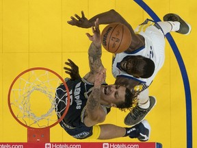 May 9, 2022; San Francisco, California, USA; Memphis Grizzlies forward Brandon Clarke fights for the rebound against Golden State Warriors forward Draymond Green during the second half of game four of the second round for the 2022 NBA playoffs at Chase Center.