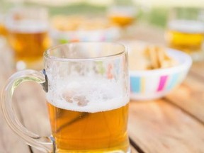 Beer and snacks on picnic table