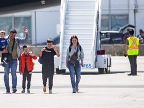 Roman and Olha Koval, and their three sons, Oleh, 11, Taras, 7, and Yurii, 3, are among 28 people fleeing the war from Ukraine, arriving at a terminal at Toronto Pearson International Airport on a plane from Poland,  operated by Samaritan’s Purse Canada on Sunday May 15, 2022.