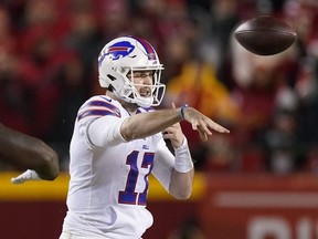 Buffalo Bills quarterback Josh Allen (17) throws a pass during the first half of an NFL divisional round playoff football game against the Kansas City Chiefs, Sunday, Jan. 23, 2022, in Kansas City, Mo.