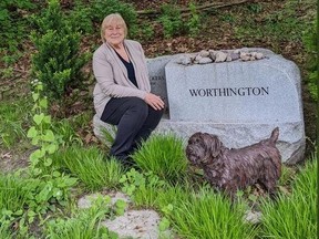 Columnist Christina Blizzard is pictured in front of Toronto Sun founding editor Peter Worthington's tomb stone