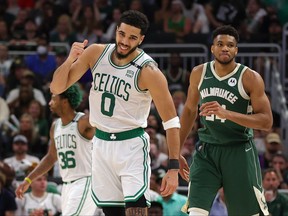 Jayson Tatum of the Boston Celtics celebrates a basket against Giannis Antetokounmpo of the Milwaukee Bucks during the third quarter in Game 6 of the 2022 NBA Playoffs Eastern Conference Semifinals at Fiserv Forum on May 13, 2022 in Milwaukee, Wis.