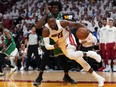 Miami Heat centre Bam Adebayo (13) moves the ball around Boston Celtics defender Robert Williams III (44) during Game 1 of the 2022 Eastern Conference finals at FTX Arena.