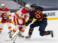 Edmonton Oilers Connor McDavid (97) scores on the Calgary Flames as he gets the puck past Christopher Tanev