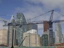 This file photo shows skyscrapers under construction in Toronto on April 23, 2019.