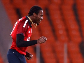 Cricket - Fourth Twenty20 International - India v England - Narendra Modi Stadium, Ahmedabad, India - March 18, 2021 England's Jofra Archer celebrates the wicket of India's Rohit Sharma.