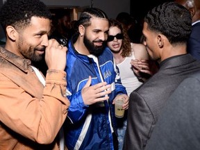 Drake (C) attends Talk of The Town, celebrating Jack Harlow’s album release, "Come Home The Kids Miss You," at Ice Hous, in Louisville, Ky., on May 7, 2022.