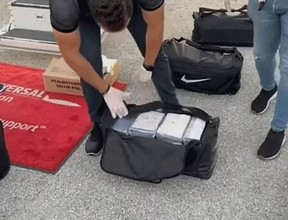 Eight black gym bags, each containing 25 smaller packages of cocaine, totalling 200 packages, were located in the aircraft’s control compartments.