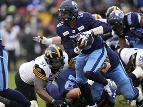 Toronto Argonauts quarterback Antonio Pipkin carries the ball against the Hamilton Tiger-Cats during the Canadian Football League Eastern Conference Final game at BMO Field.
