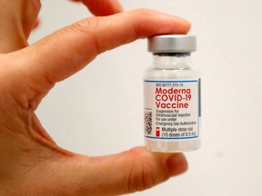 A healthcare worker holds a vial of the Moderna COVID-19 Vaccine at a pop-up vaccination site operated by SOMOS Community Care during the coronavirus disease (COVID-19) pandemic in Manhattan in New York City, New York, U.S., January 29, 2021.