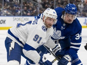 Tampa Bay Lightning's Steven Stamkos and Toronto Maple Leafs' Auston Matthews battle during a face-off during second period NHL action in Toronto on Thursday, November 4, 2021.