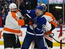 Toronto Maple Leafs forward Michael Bunting and Philadelphia Flyers defenseman Keith Yandl battle for position in the third period at the Scotiabank Arena. 