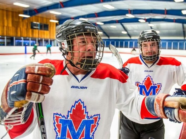 David Patrick, 75, and his son, Jason Patrick, are pictured during a shinny hockey game at   Moss Park Arena in downtown Toronto on May 15, 2022. 