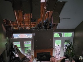 Interior of home shows giant hole in ceiling/roof after lightning struck home.