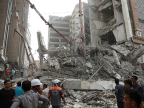 Rescue crews work at the site of a building collapse in Abadan, Iran May 23, 2022.
