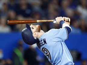 Danny Jansen of the Blue Jays watches his pop fly in the third inning against the Seattle Mariners at Rogers Centre on May 18, 2022 in Toronto.