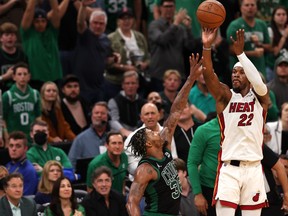 Jimmy Butler of the Miami Heat shoots a three point basket against Marcus Smart of the Boston Celtics during the fourth quarter in Game 6 of the 2022 NBA Playoffs Eastern Conference Finals at TD Garden on May 27, 2022 in Boston.