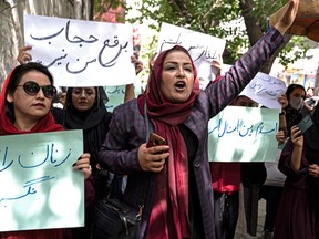 Members of Afghanistan's Powerful Women Movement take part in a protest in Kabul on May 10, 2022.