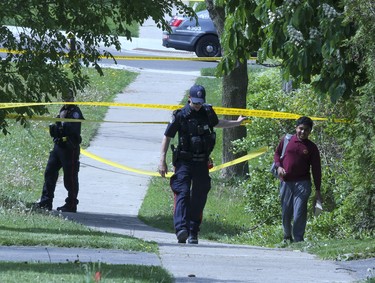A man with a rifle was shot by police in the East Ave and Lawrence area on Thursday May 26, 2022. Veronica Henri/Toronto Sun/Postmedia Network