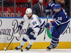 Nikita Kucherov of the Tampa Bay Lightning controls the puck against Mark Giordano of the Toronto Maple Leafs at Scotiabank Arena on May 2, 2022 in Toronto.