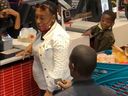 A man kneels during a marriage proposal to his partner at a busy McDonald's in South Africa.