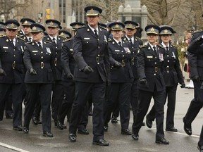Police march at the annual Ceremony Of Remembrance at Queen's Park on May 1, 2022.