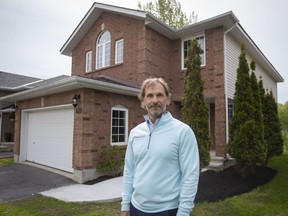 Real estate agent Luca Andolfatto poses for a portrait in Kingston, Ont., Saturday, May 21, 2022.