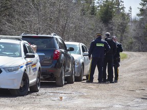 RCMP officers maintain a checkpoint on a road in Portapique, N.S. on April 22, 2020. The inquiry into the 2020 mass shooting in Nova Scotia is expected to hear today from a retired senior Mountie who has been granted special accommodations to ensure he is not re-traumatized by having to relive that tragic, 13-hour event.