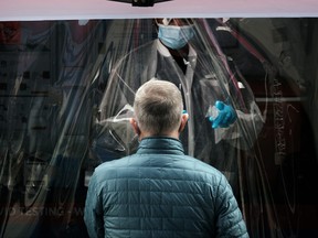 A medical worker administers tests at a COVID-19 testing site in Brooklyn on April 18, 2022 in New York City.