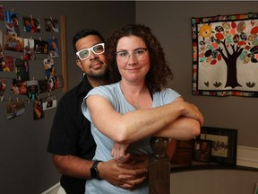 Rohit Saxena and Lesley Spencer pose for a photo in Ottawa Tuesday. The couple lost their six month old baby to SIDS in 2016.