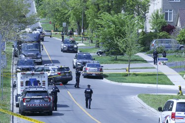 A man with a rifle was shot by police in the East Ave and Lawrence area on Thursday May 26, 2022. Veronica Henri/Toronto Sun/Postmedia Network