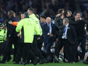 Soccer Football - Premier League - Everton v Crystal Palace - Goodison Park, Liverpool, Britain - May 19, 2022
Everton manager Frank Lampard celebrates avoiding relegation from the Premier League after the match as Crystal Palace manager Patrick Vieira is escorted off the pitch by security.