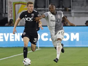 May 21, 2022; Washington, District of Columbia, USA; D.C. United defender Julian Gressel dribbles the ball as Toronto FC forward Ayo Akinola chases in the second half at Audi Field.