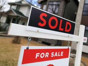 A home for sale and sold sign in Calgary, May 4, 2021.