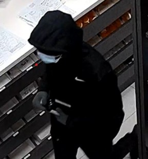 Security footage of a one of two suspects in a pharmacy robbery in Milton. HALTON REGIONAL POLICE HANDOUT