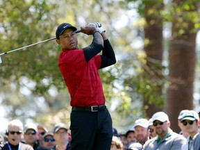 Tiger Woods plays his shot from the fourth tee during the final round of the Masters at Augusta National Golf Club