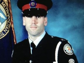 Blake Acton is pictured in his police uniform